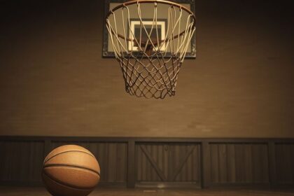 Vintage peach basket on pole, old basketball, gymnasium.